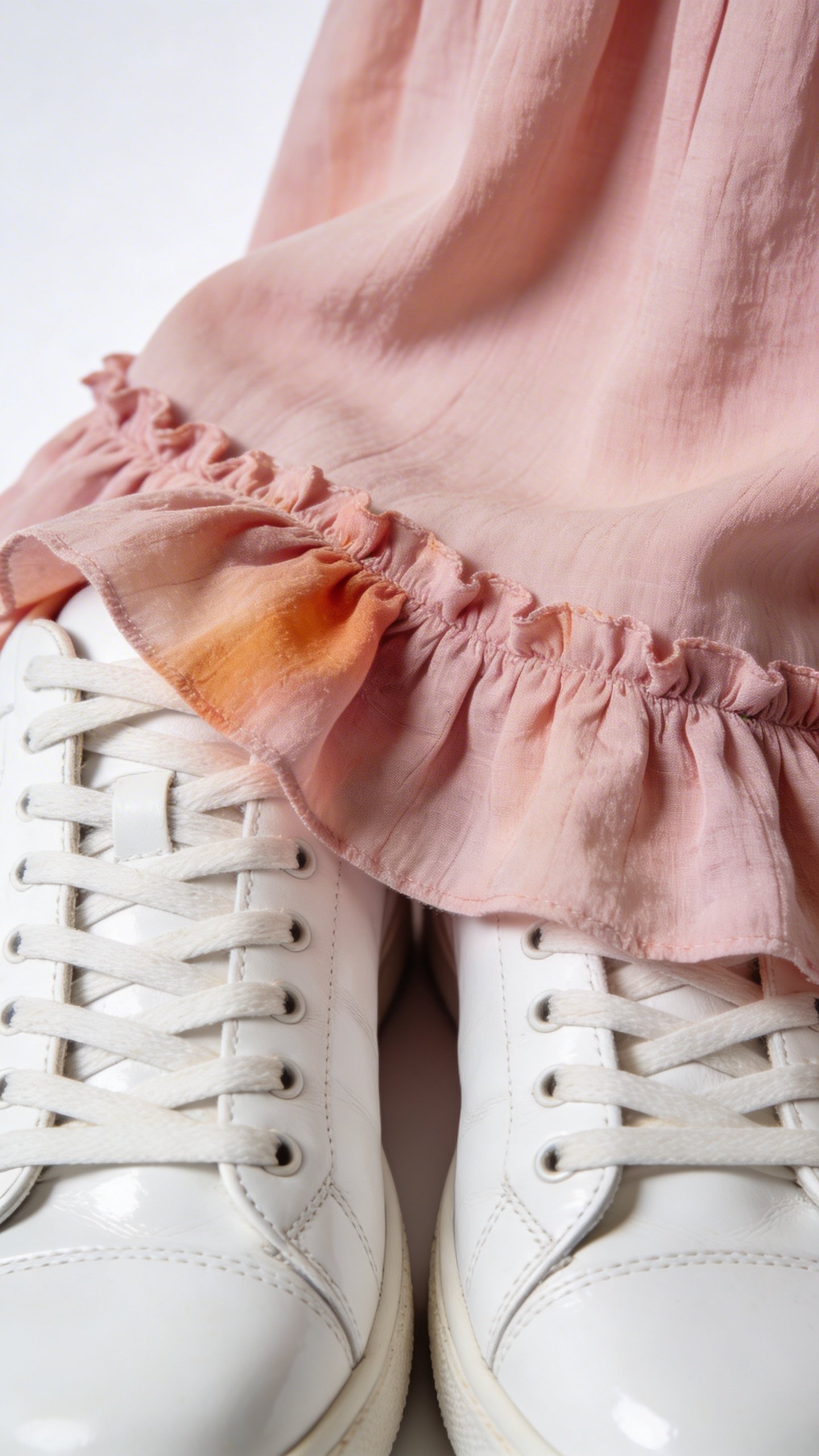 White leather sneakers with pink dress hem detail