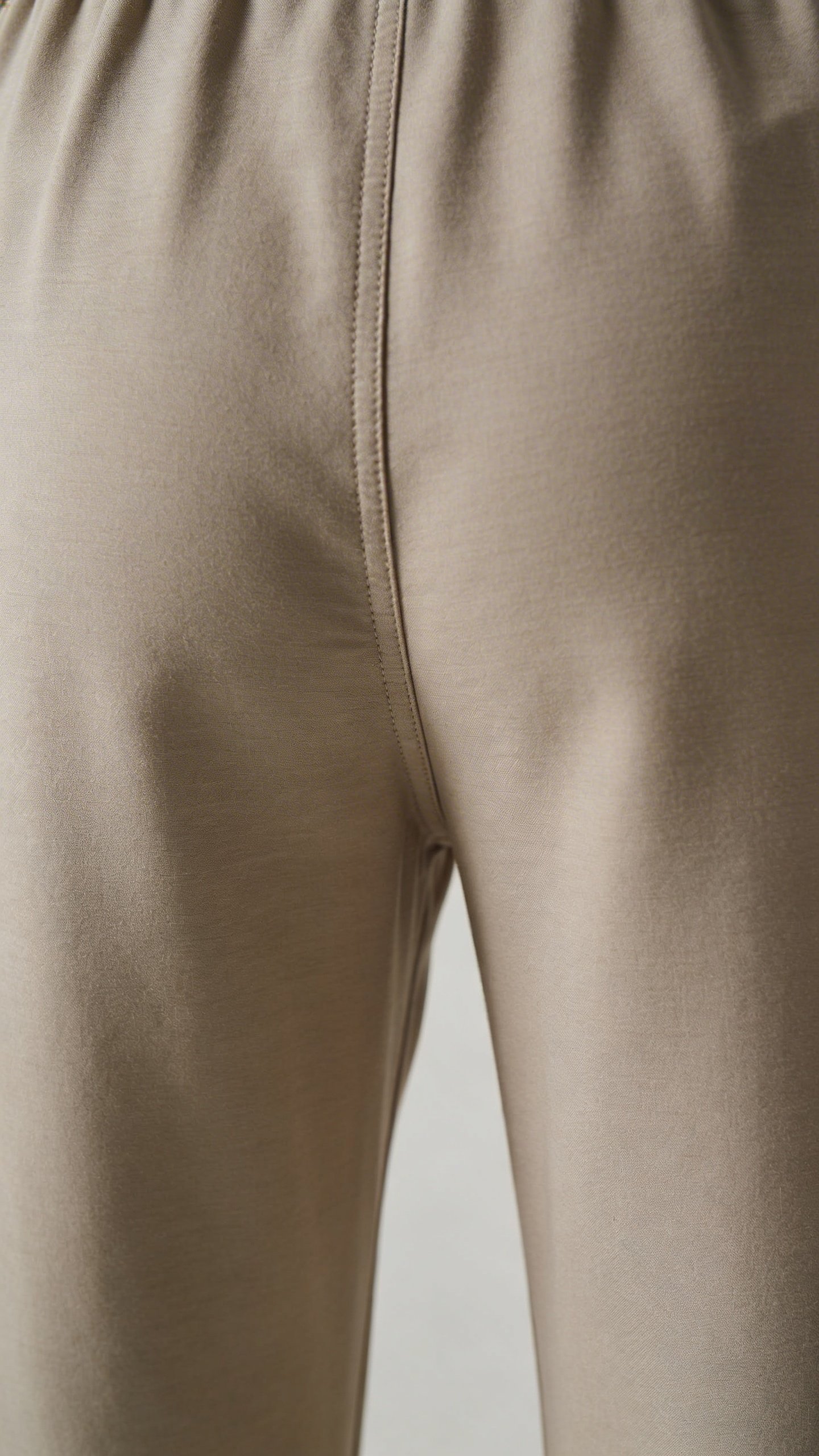 Closeup of jumpsuit crotch seam showing proper fit
