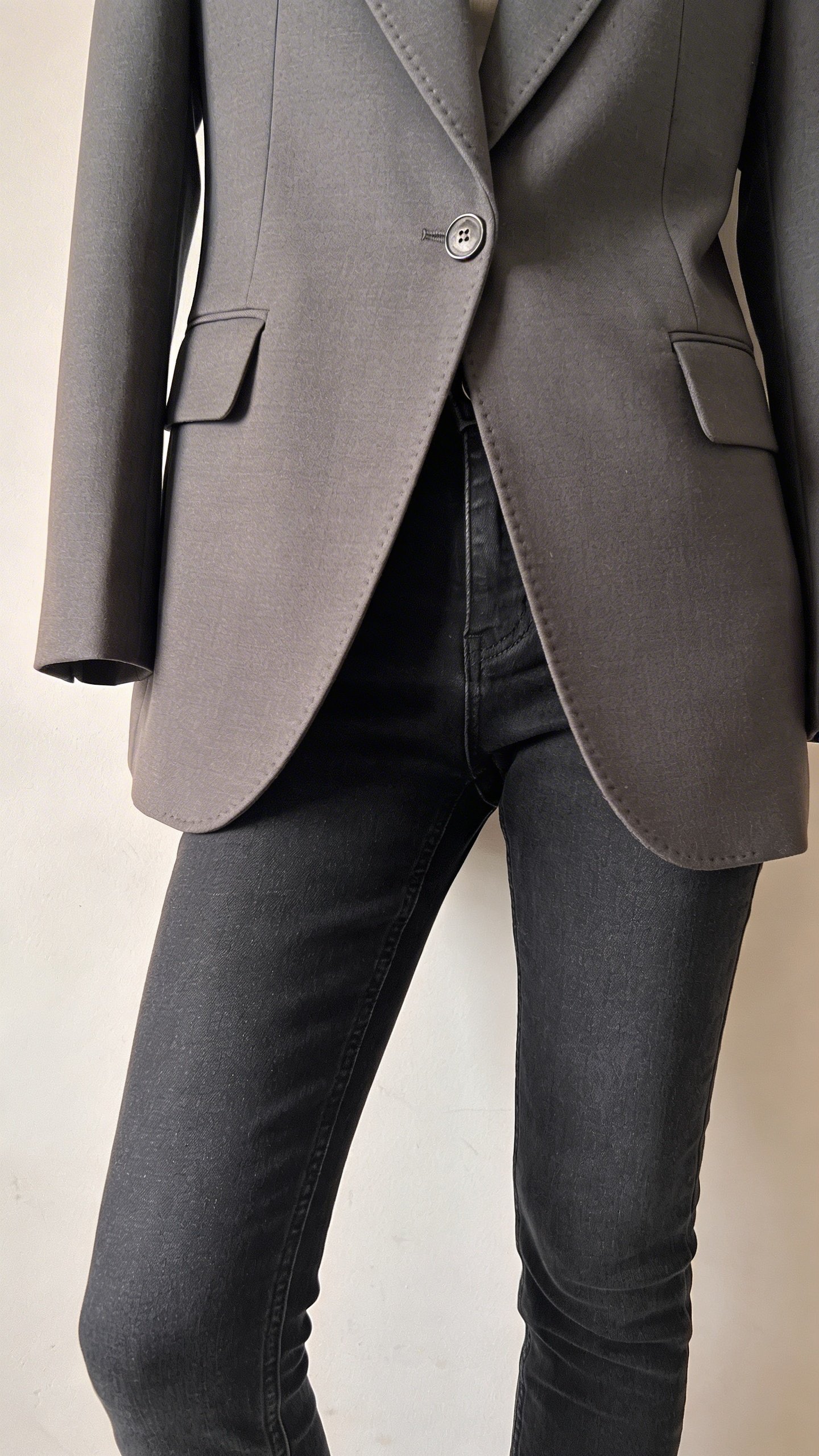 Tailored blazer paired with slim-fit dark jeans