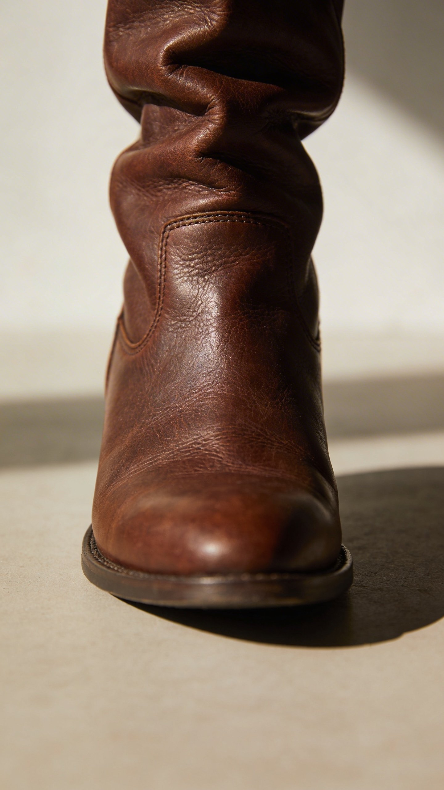Single Frye Melissa slouch boot detail shot, leather texture