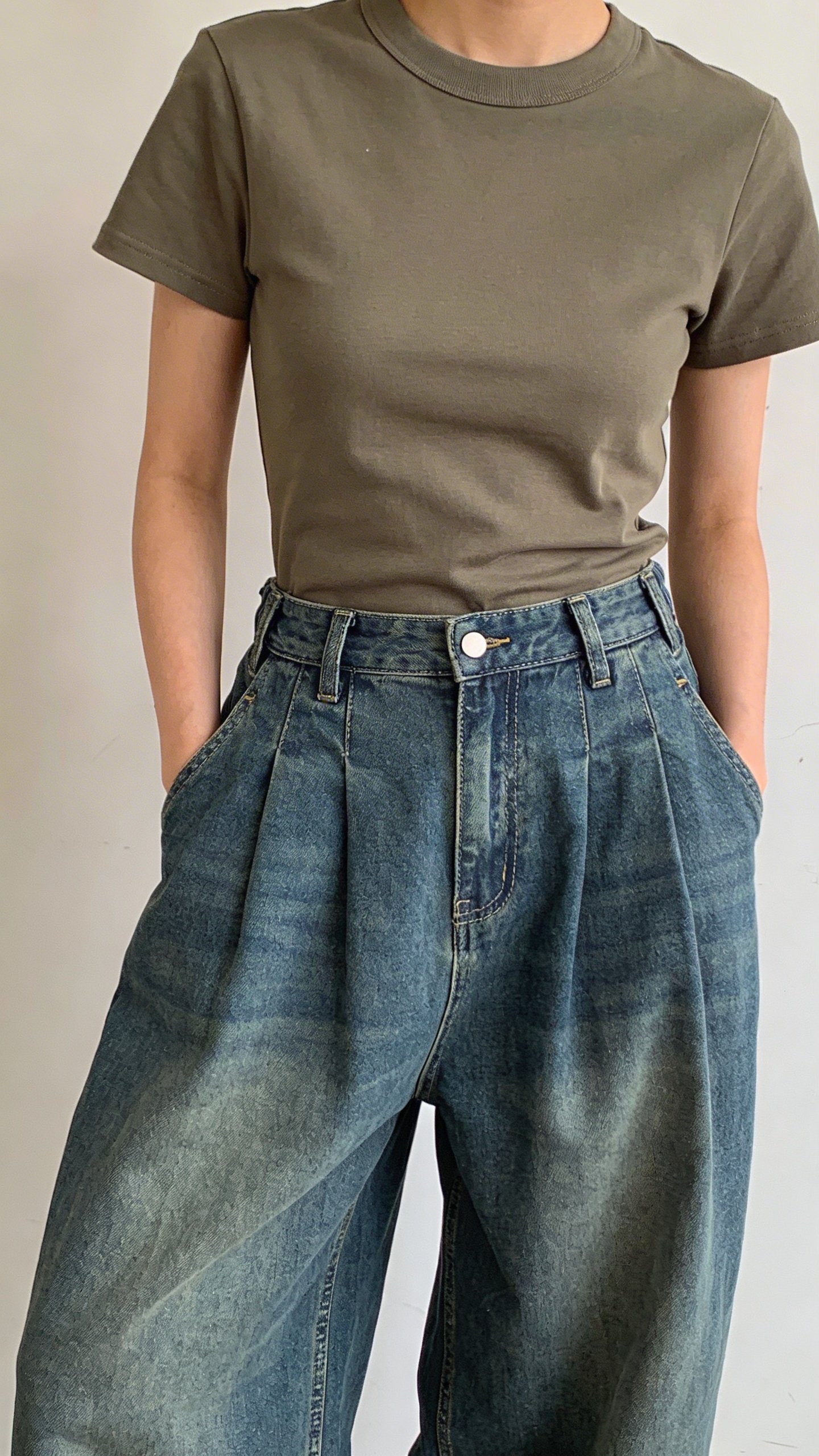 Front view baggy jeans paired with fitted baby tee