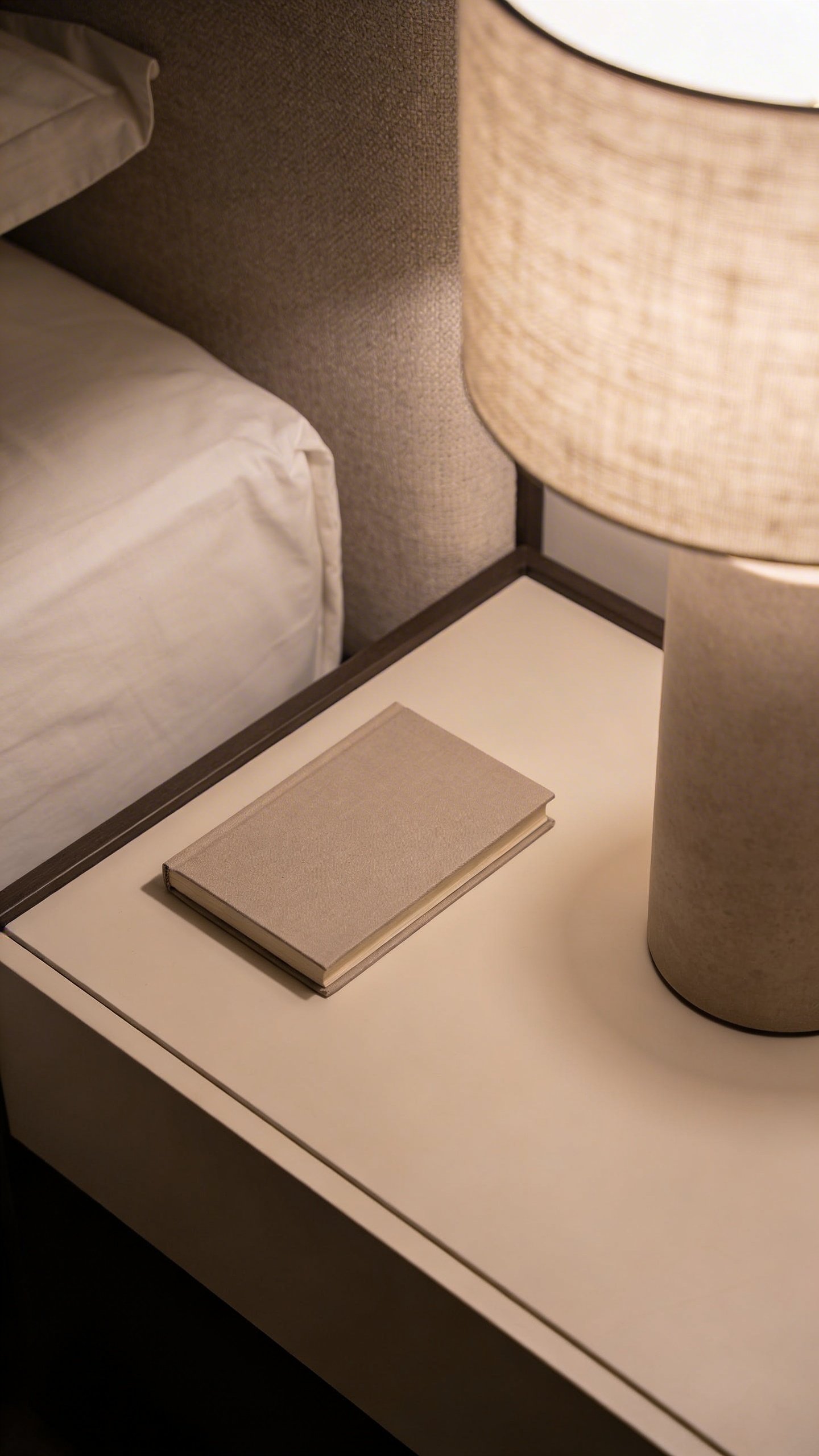Neatly organized minimalist nightstand with single lamp