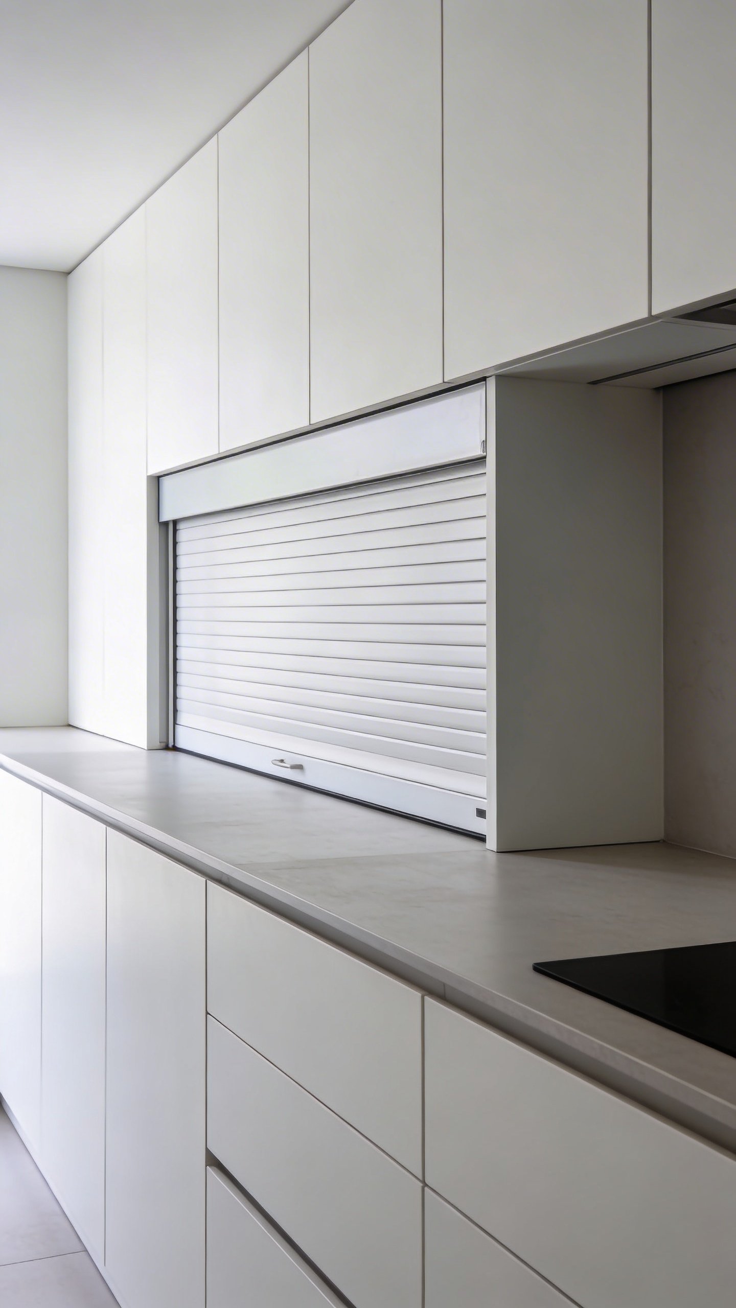 Minimalist kitchen counter with concealed appliance garage door