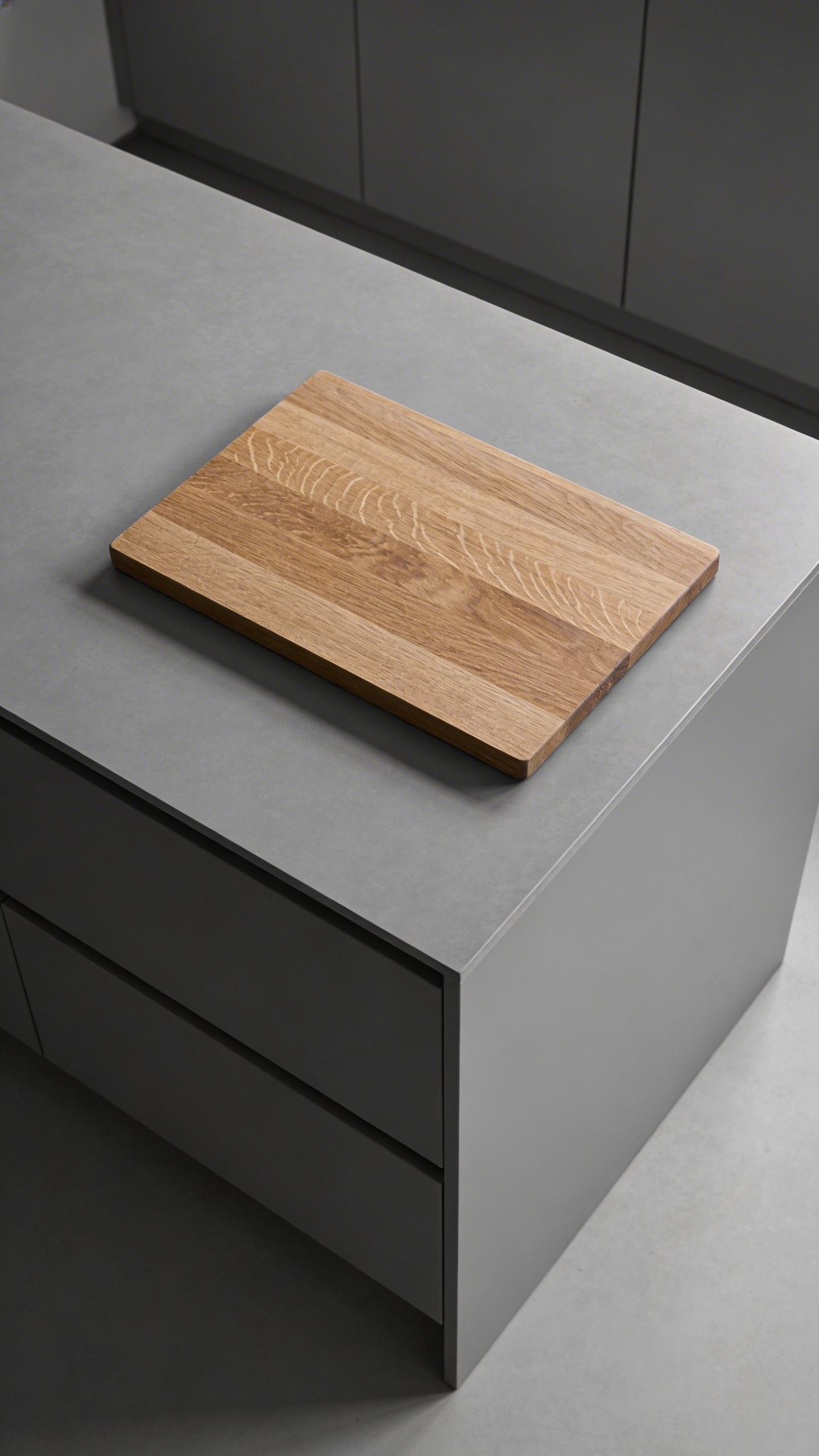 Minimalist gray kitchen island with wooden cutting board