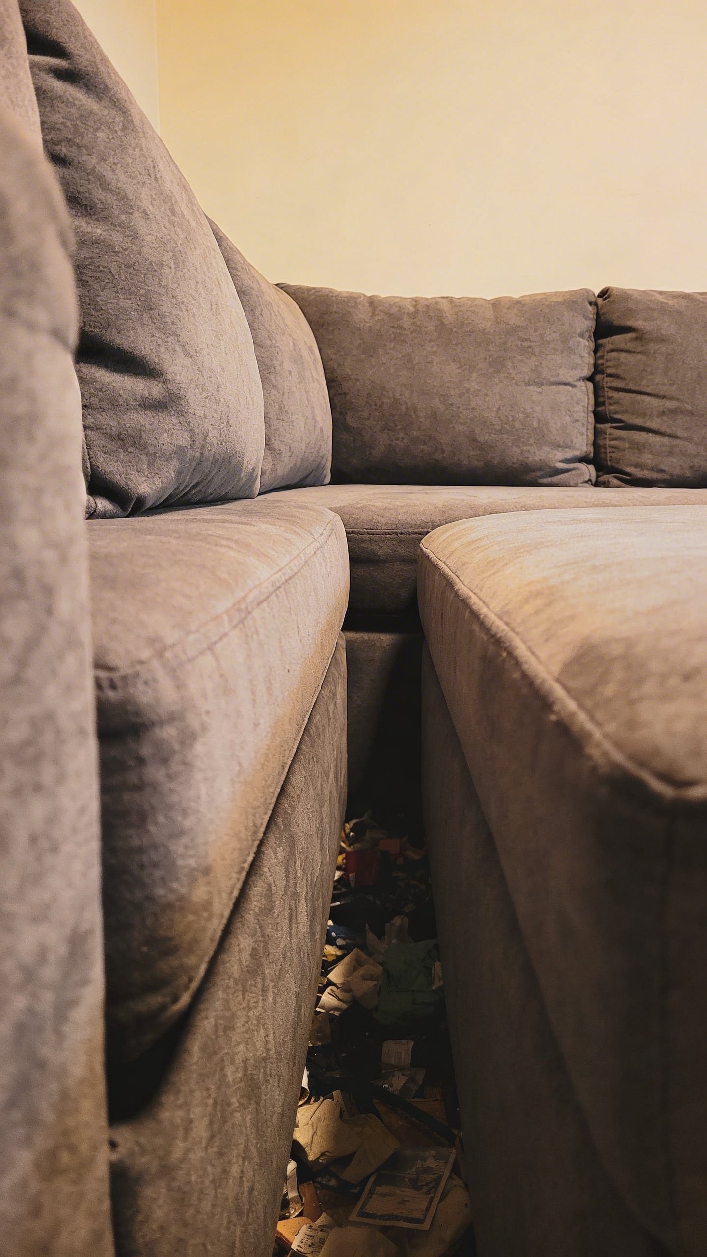 Oversized gray sectional sofa crowding small living room