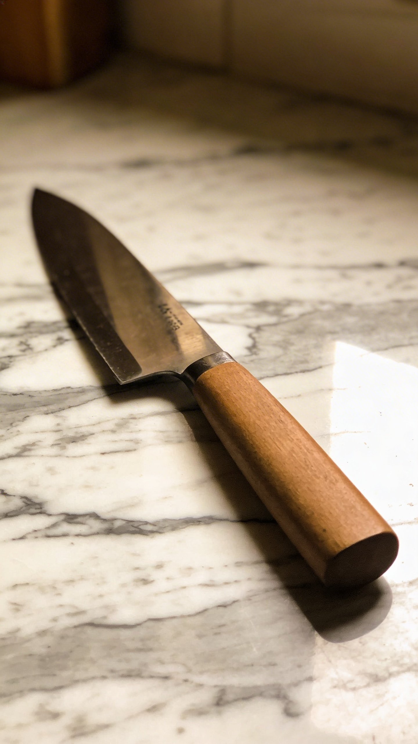 Single 8-inch chef's knife on marble countertop