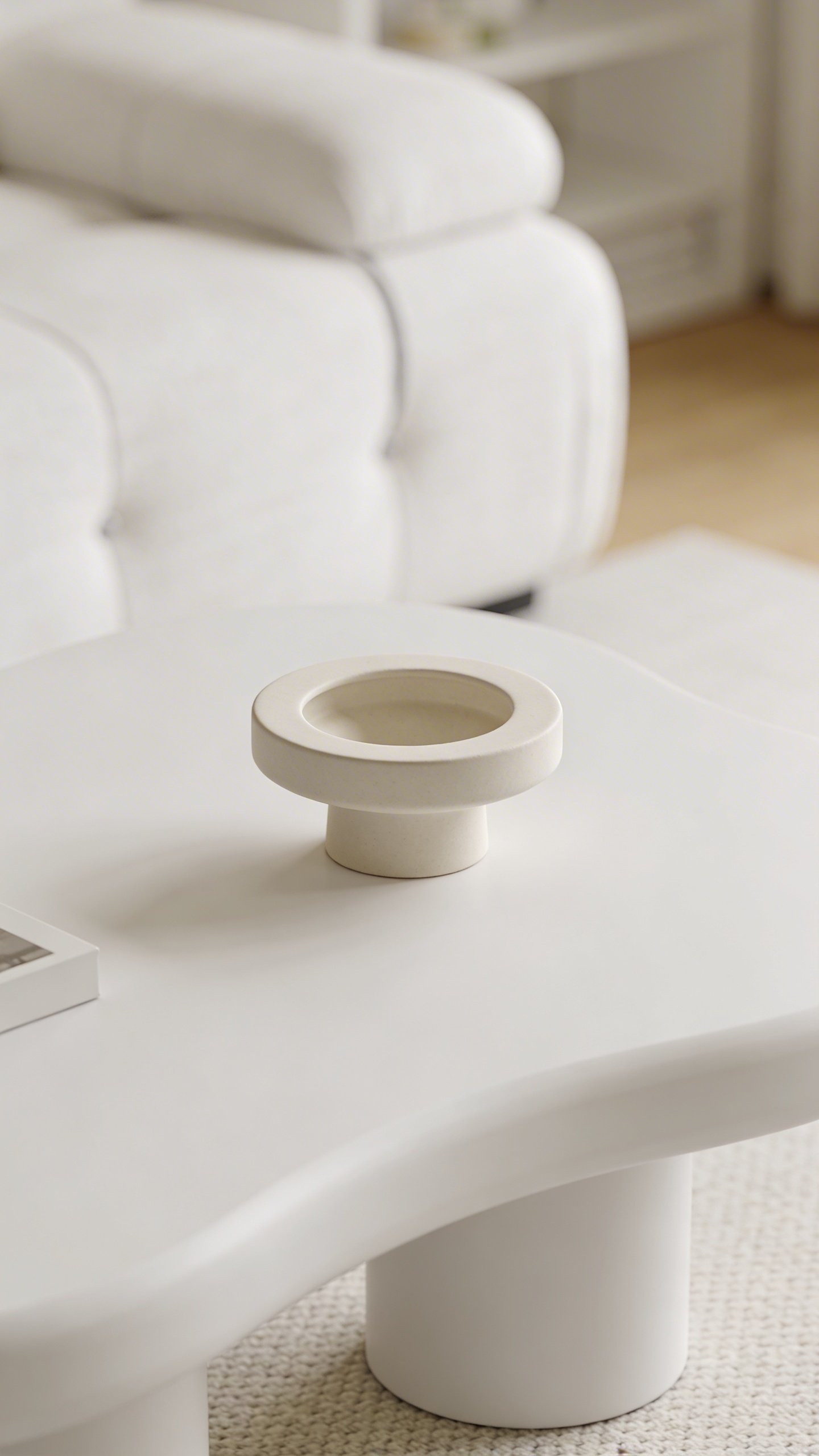 Organized white coffee table with single decorative item